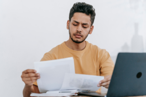 Focus man reviewing papers