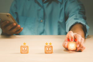 Man using a Smiley Faces system to review